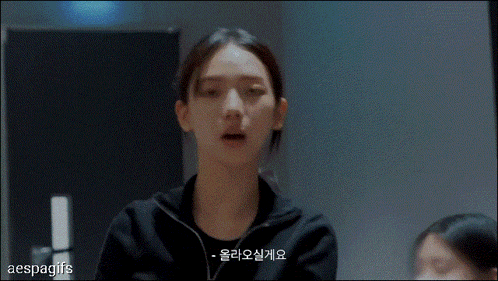 a gif of a woman covering her face with her hands and the words aespagifs on the bottom