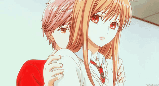 a girl in a red shirt is hugging a boy in a white shirt and tie
