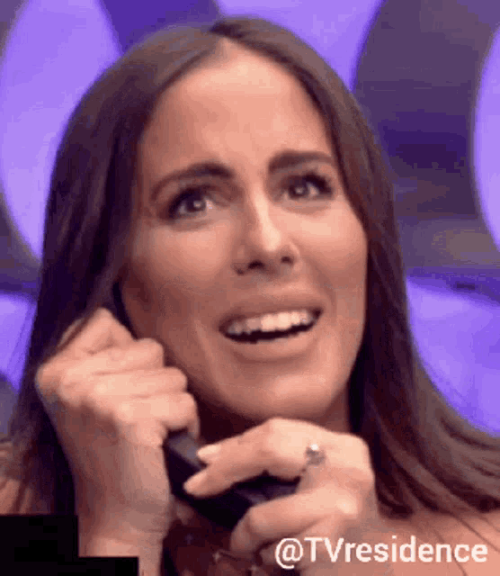 a woman is smiling while talking on a phone with the hashtag tvresidence
