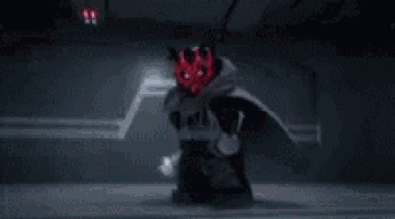 darth maul is holding a red lightsaber and the words awesome are visible in the background .