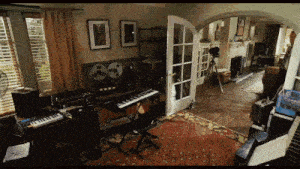 a room filled with a lot of musical instruments including a piano