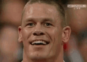 a man is smiling in front of a crowd while watching sky sports