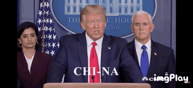 a man in a suit and tie stands at a podium and says china