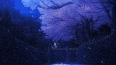 a bridge over a river with cherry blossom trees in the background at night