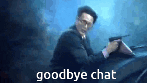 a man in a suit is holding a gun and the words goodbye chat are above him .