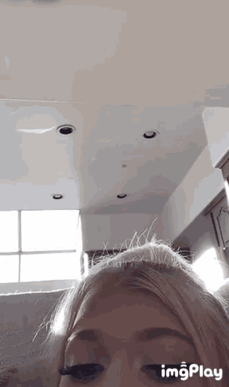 a close up of a woman 's face with the words imgplay at the top