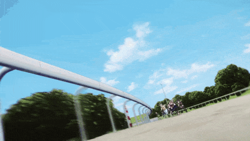 a person is riding a horse on a track with trees in the background