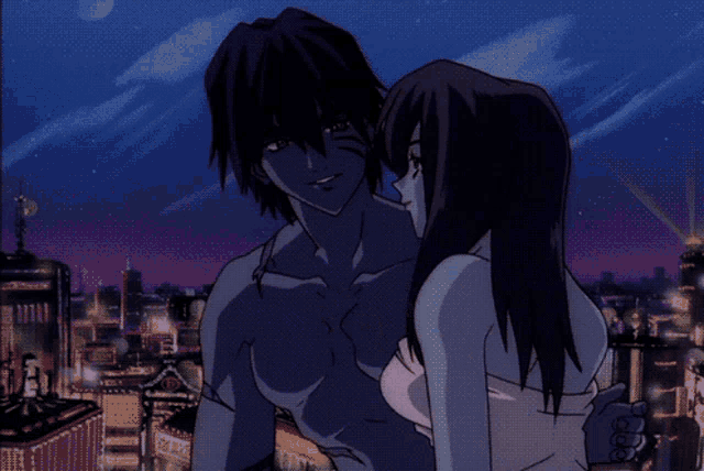 a man and a woman are kissing in front of a city