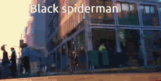 a blurry picture of a city street with the words black spiderman