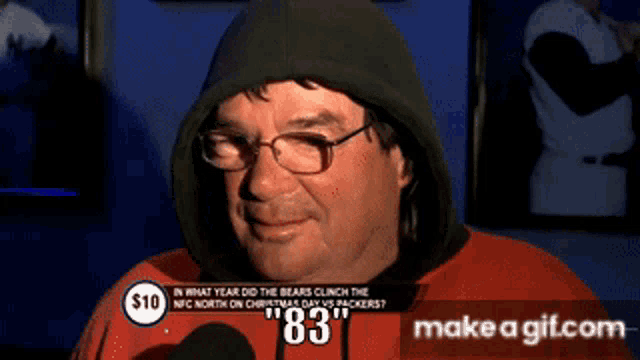 a man wearing a hooded sweatshirt with the number 83 on his face