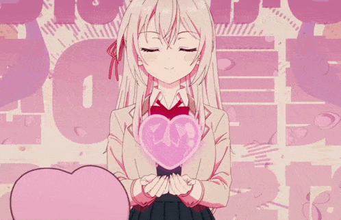 a girl is holding a pink heart with the number 20 on it in her hands