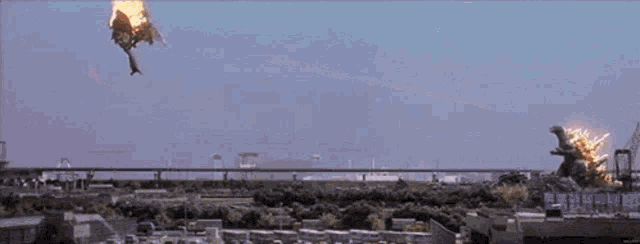 a statue of a monster shooting a beam of light in the sky