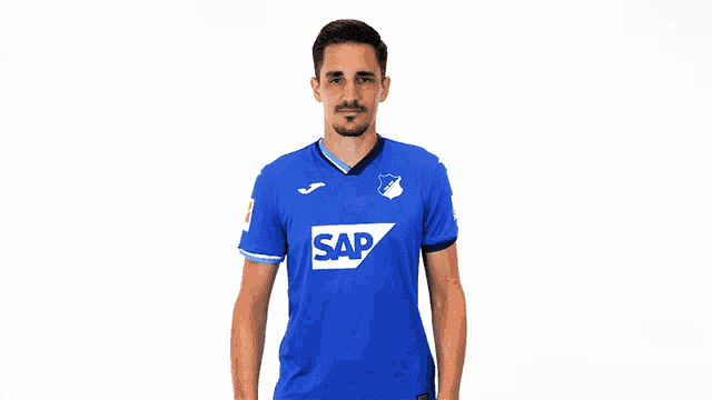 a man is wearing a blue shirt with the word sap on it