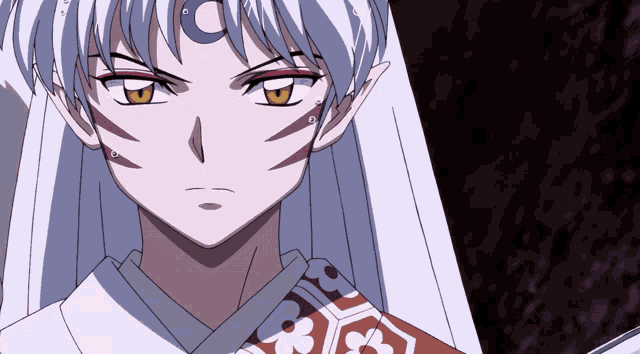 a close up of a anime character with a crescent moon on his forehead