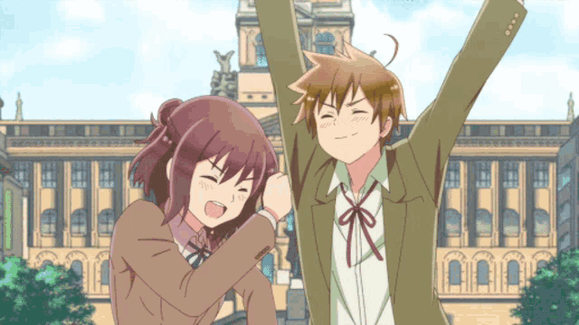 a boy and a girl with their arms in the air