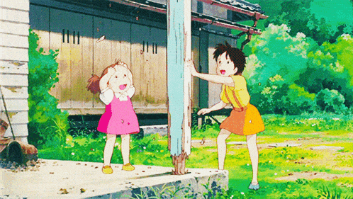 a girl in a pink dress is standing next to another girl