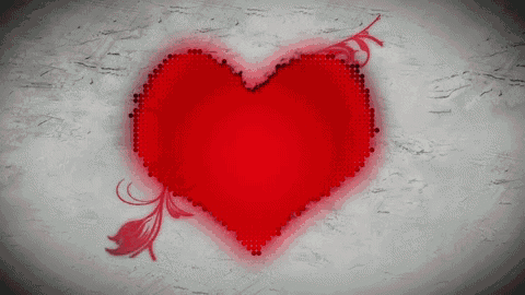 a red heart is painted on a gray background