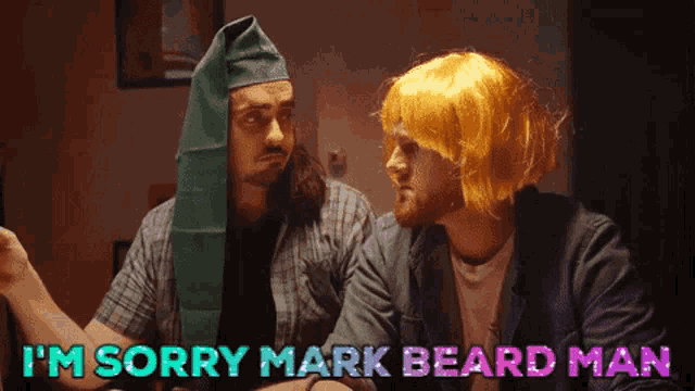 a man with a green hat says i 'm sorry mark beard man to another man with a yellow wig