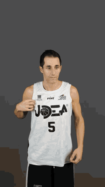 a man in a joea 5 jersey is pointing