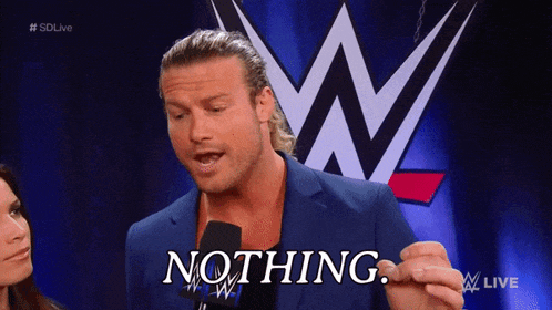 a man in a suit says nothing in front of a wwe logo