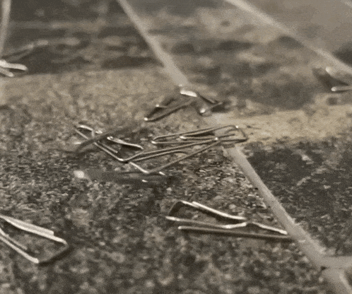 a pile of paper clips laying on a table