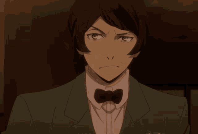 a man with a bow tie and a green jacket