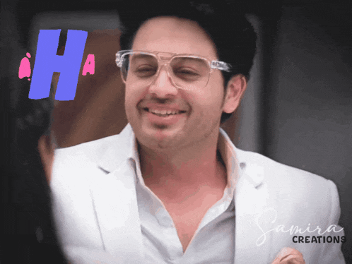 a man wearing glasses is smiling in front of a sign that says " ha "