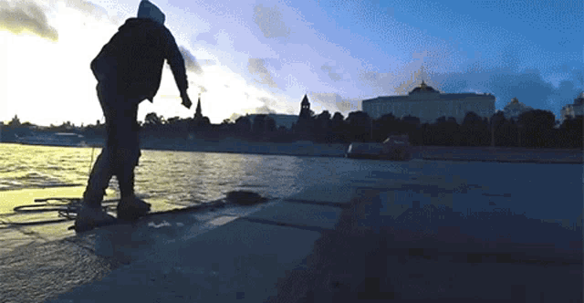 a person riding a skateboard in front of a building
