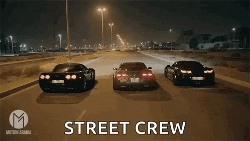 three sports cars are driving down a street with the words street crew written above them