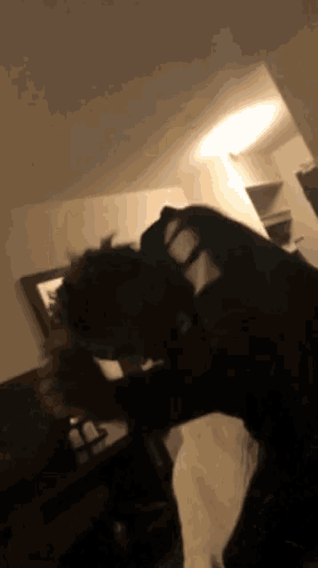 a blurry picture of a person in a black shirt