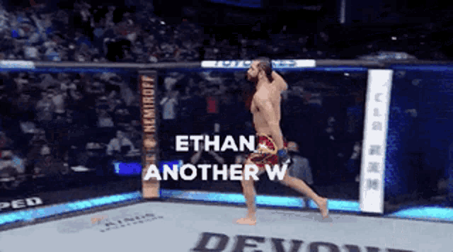 a man in a boxing ring with the words ethan another w