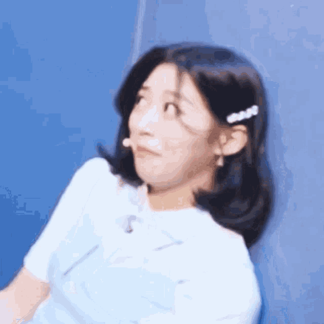 a close up of a woman making a funny face .