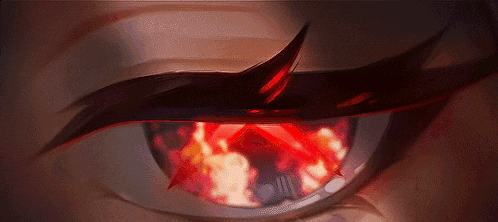 a close up of a person 's eye with fire coming out of it