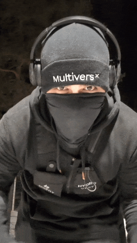 a man wearing headphones and a beanie that says multiversx