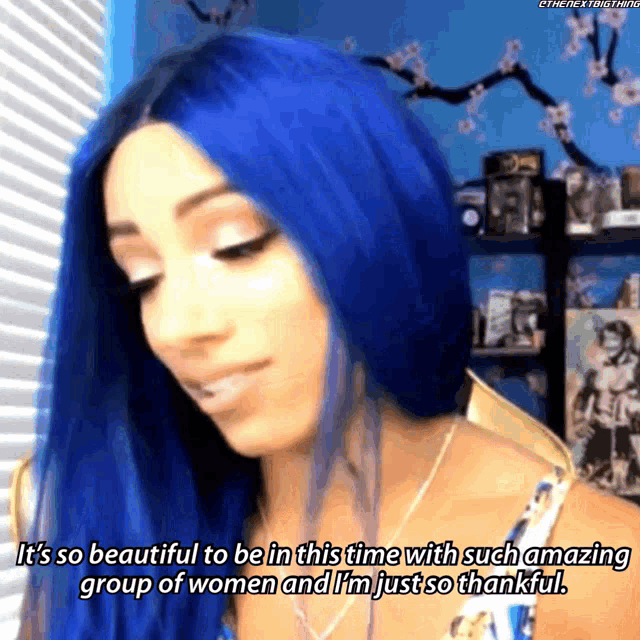a woman with blue hair says it is so beautiful to be in this time with such amazing group of women