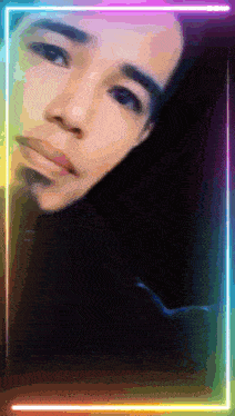 a close up of a person 's face with a neon frame surrounding it
