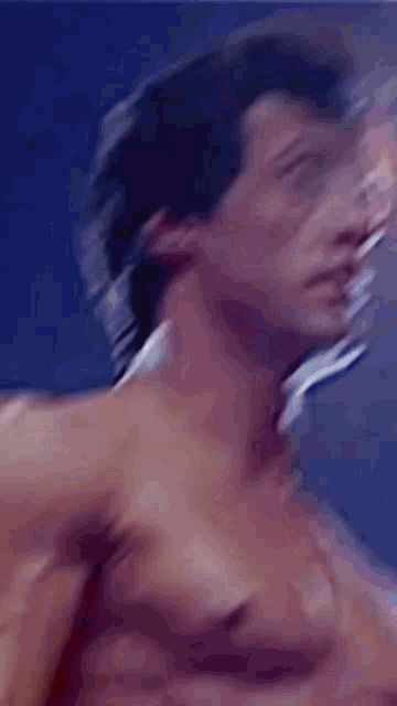 a close up of a man without a shirt looking up