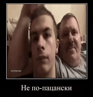 two men are sitting next to each other on a couch .