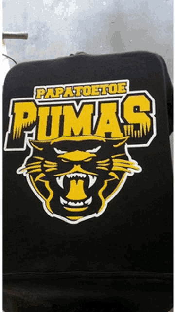 a papatoetoe pumas t-shirt with a yellow panther on it