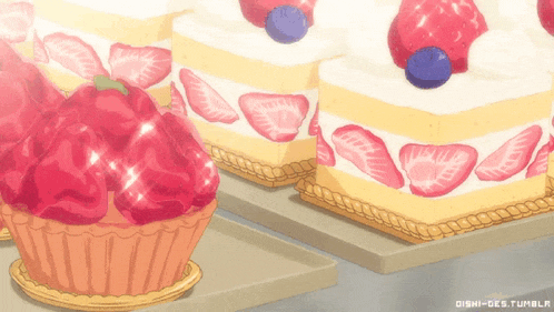 three slices of cake with strawberries and blueberries are on a table