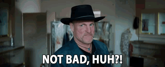 a man wearing a black hat says not bad huh