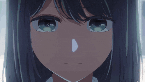 a close up of a girl 's face with a light coming out of her nose