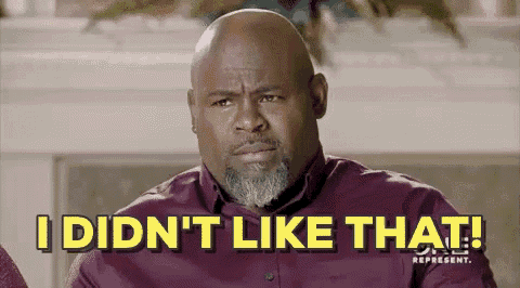 a bald man with a beard is sitting on a couch and says `` i did n't like that '' .