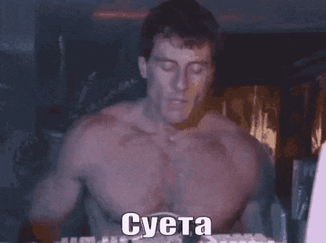a shirtless man wearing headphones with the word cyta written on it