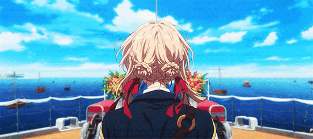 a girl with blonde hair and red ribbons in her hair is standing on a boat overlooking the ocean