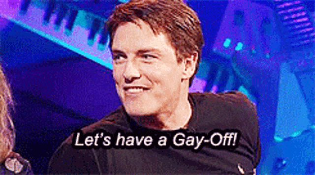 a man says " let 's have a gay-off " in a dark room