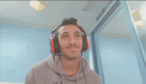 a man wearing headphones and a sweatshirt that says nivea on it