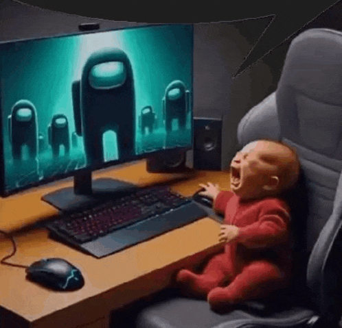 a baby is crying in front of a computer monitor .