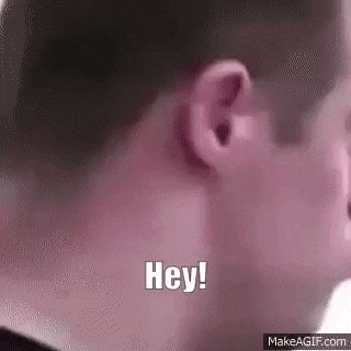 a close up of a person 's ear with the words `` hey ! ''
