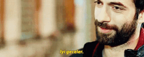 a close up of a man with a beard and the words iyi geceler